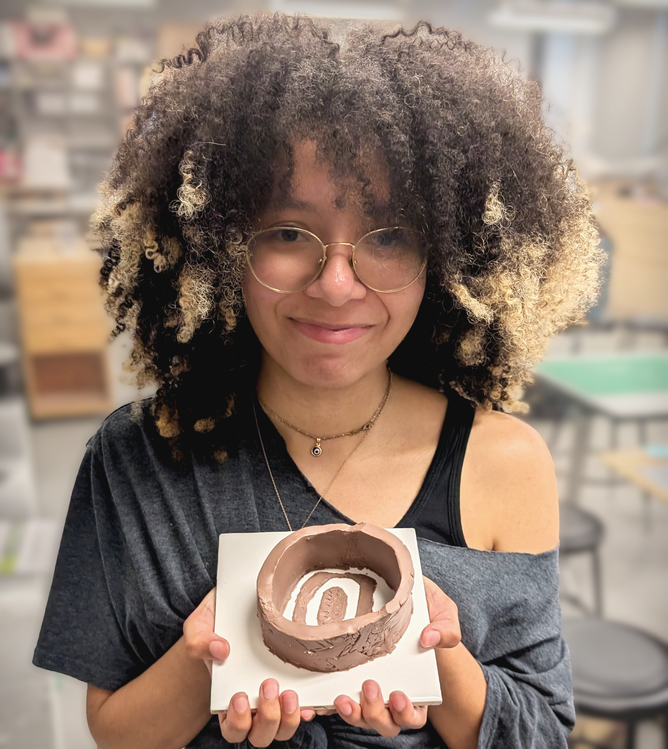Naomi holding a mold